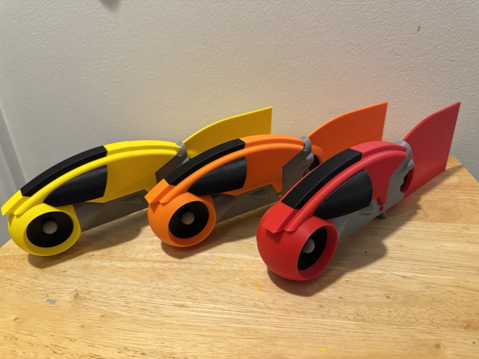 Tron Lightcycles With Light Trails. 3D Printed. Yellow. Orange. Red.