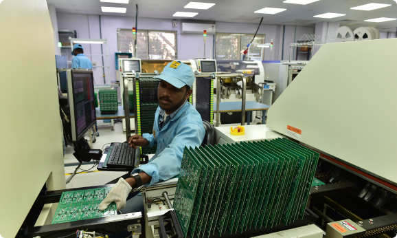 Technician working on a PCB assembly line