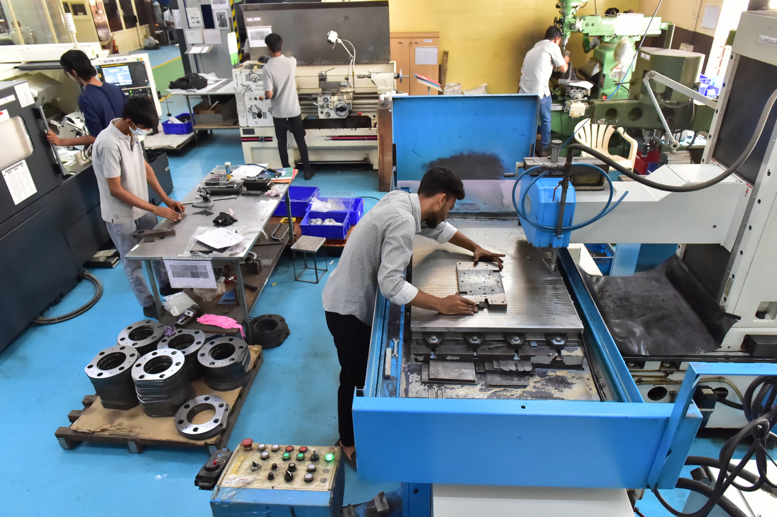 Machinists operating CNC and milling machines at the ELCIA common facility centre