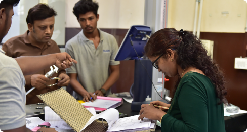 Design team reviewing drawings and components