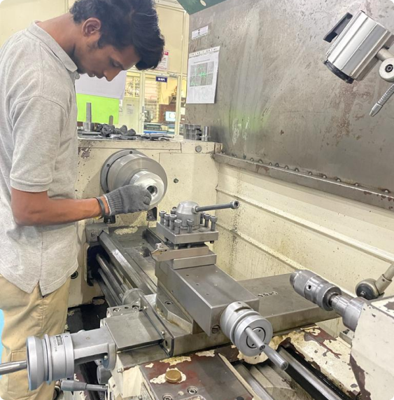 Machinist operating a precision lathe